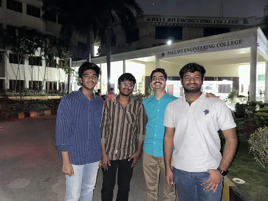 The team outside Pallavi Engineering College at night